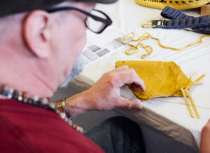 Senior veteran working on craft kit